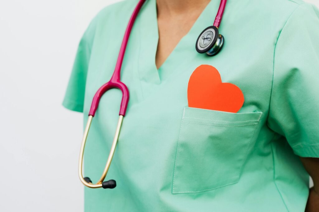 pexels-photo-5207102-5207102 A healthcare professional with a stethoscope and red heart symbol emphasizes cardiology care.